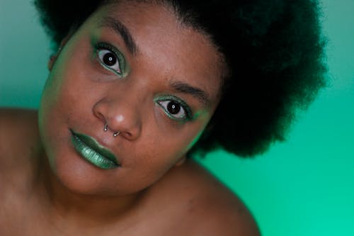 Free Portrait Shot of an Afro-Haired Woman with Nose Piercing Stock Photo