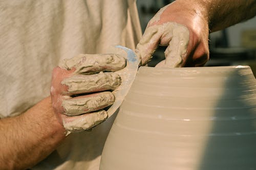 Free Close-Up Shot of a Person Molding a Clay Pot Stock Photo