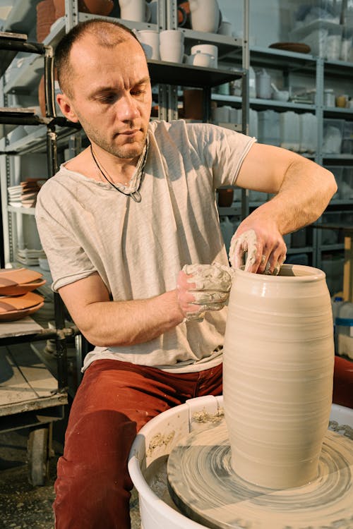 Free A Man Molding a Clay Pot Stock Photo