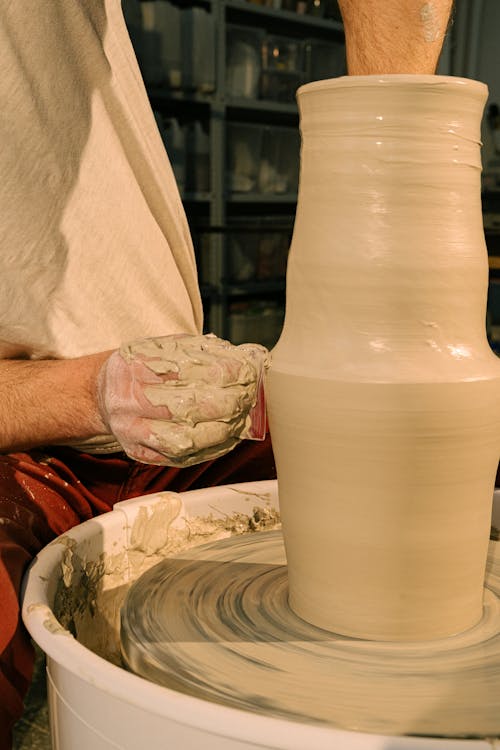 Free Person Molding A Ceramic Vase from Clay Stock Photo