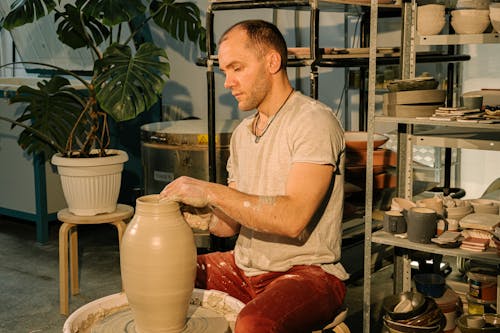 Man Molding A Ceramic Vase from Clay