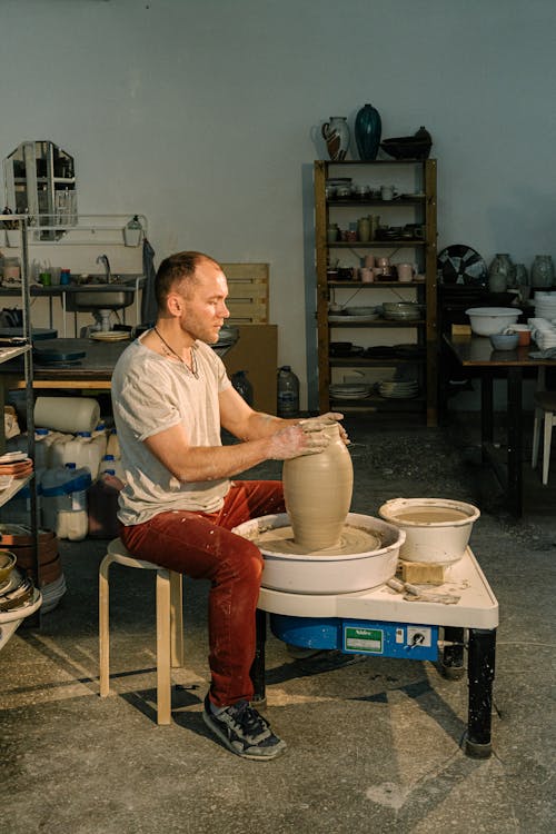 Photo of Man Molding Clay Jar