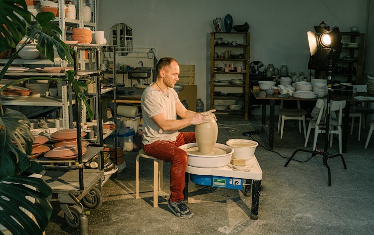 Photo Of Man Molding Clay Jar