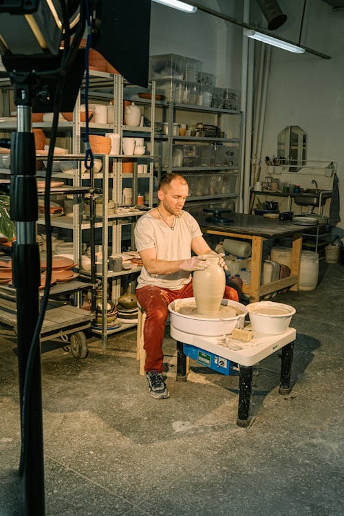 Photo of Man Molding Clay Jar