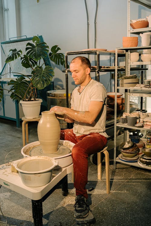 Photo of Man Molding Clay Jar