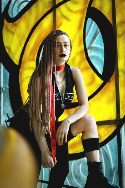 Free Brutal informal woman with long braids Stock Photo