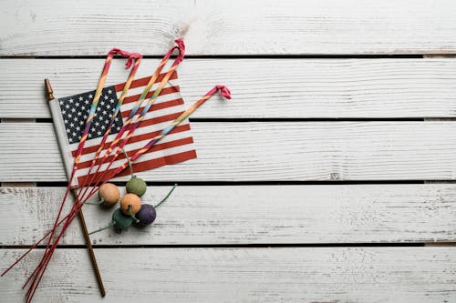 Free Bengal lights and tiny bombs on American Flag Stock Photo