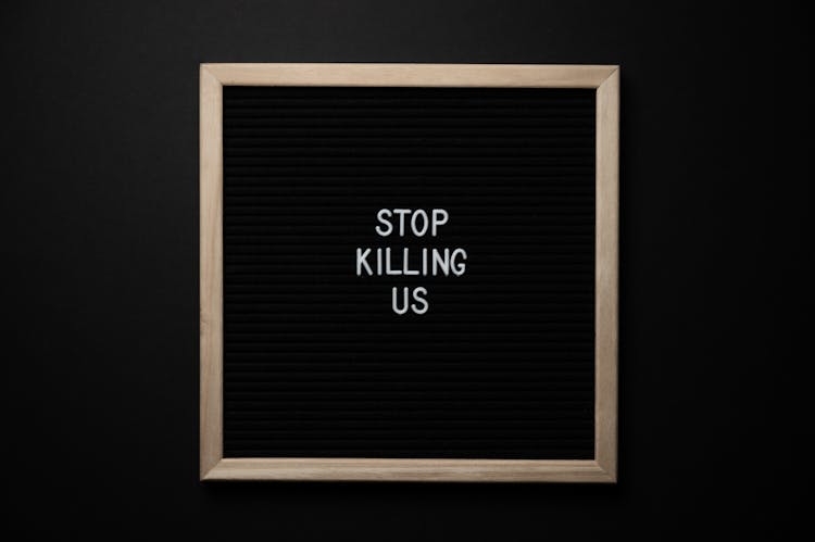 Phrase Stop Killing Us On Signboard