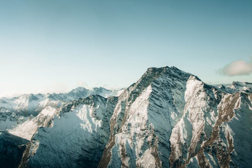 Snowy Mountains Under Blue Sky