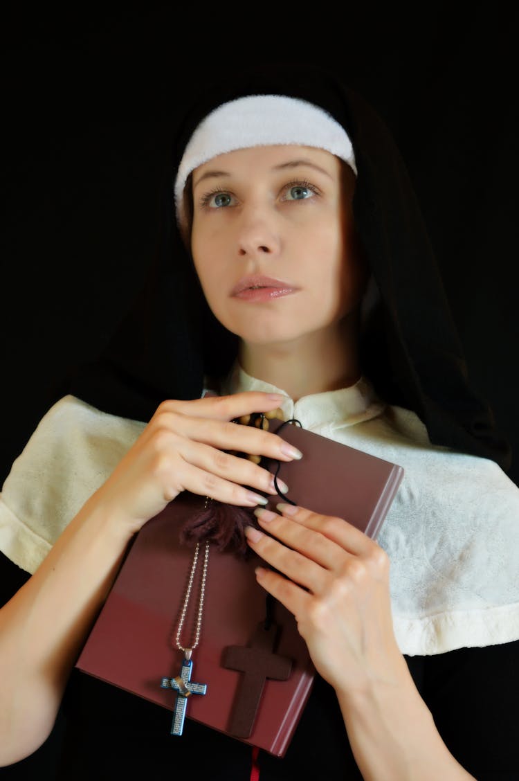 Calm Woman With Bible And Cross