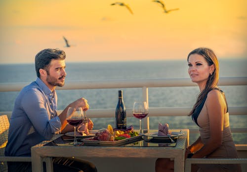 A Couple Sitting at the Table