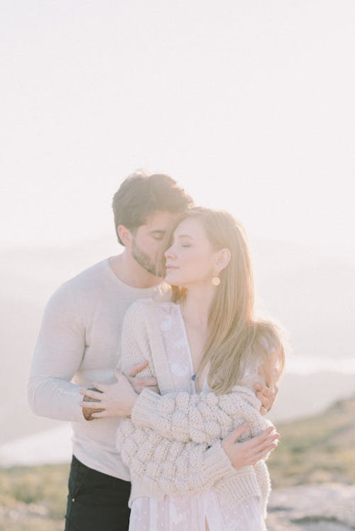 Man Kissing His Girlfriend on the Cheek