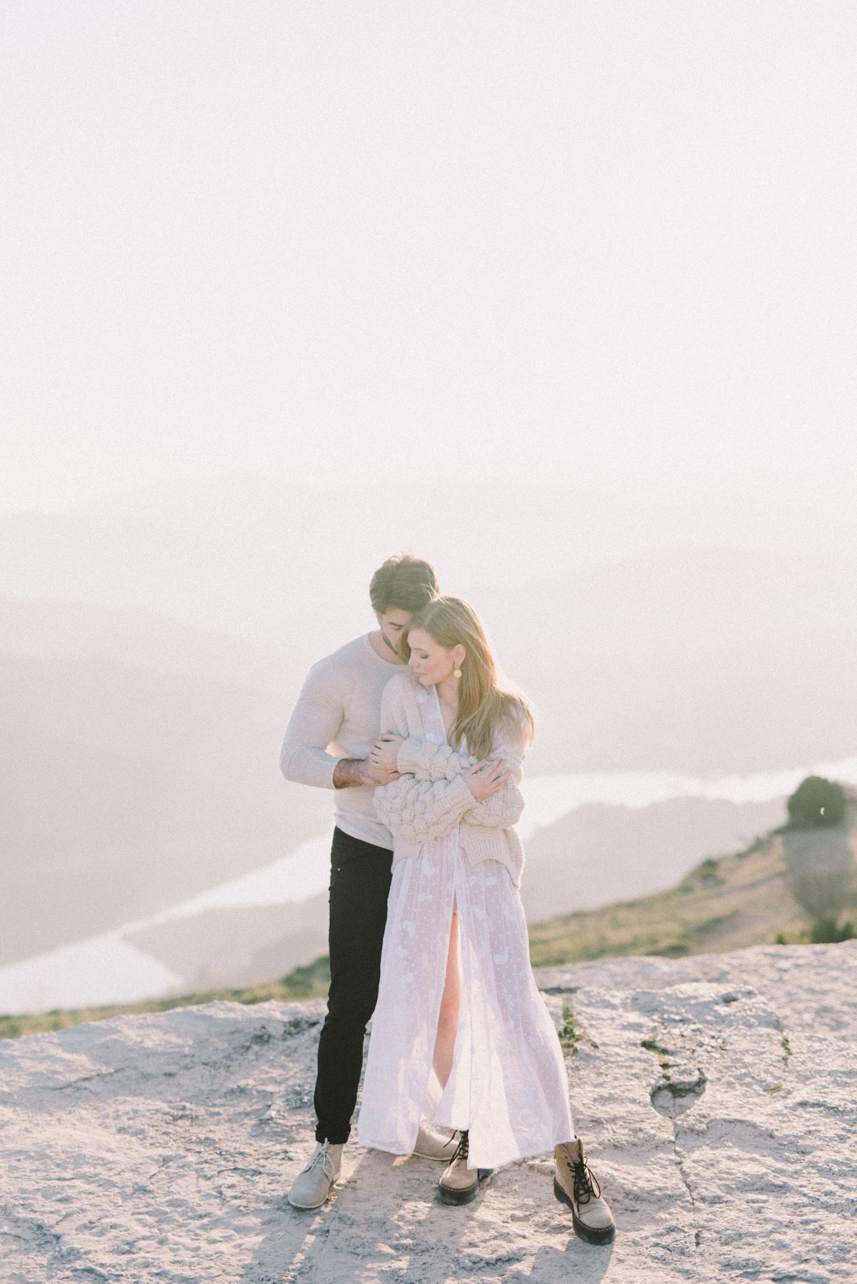 Romantic couple embracing on a scenic mountain trip