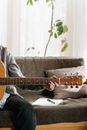 Person Playing Brown Acoustic Guitar