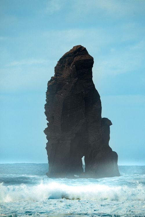Free Dramatic sea stack rising from the ocean in Portugal, showcasing unique geology and natural beauty. Stock Photo