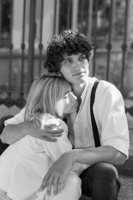 Intimate and tender portrait of a couple embracing, conveying love and togetherness in black and white.