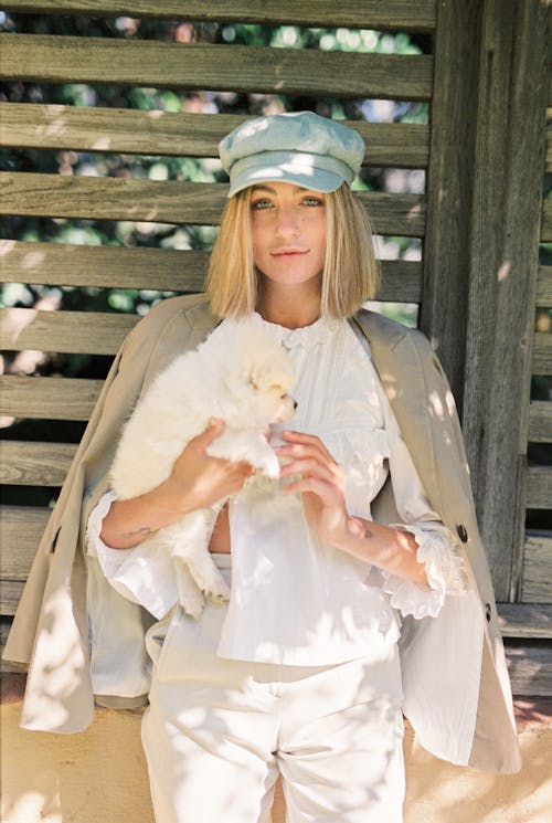 Photo of Woman Holding a Puppy