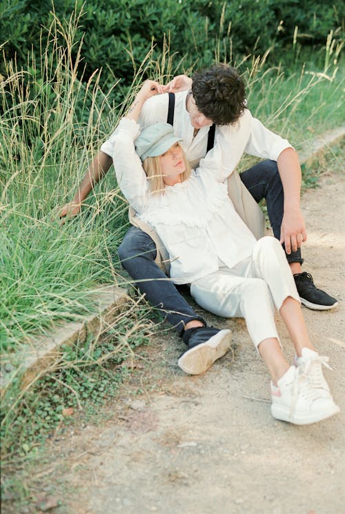 Stylish Couple Sitting on the Ground