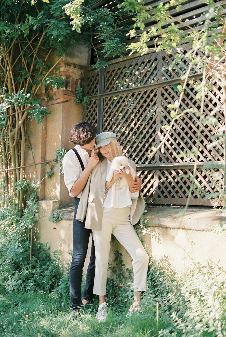 A Couple With Their Pet Dog