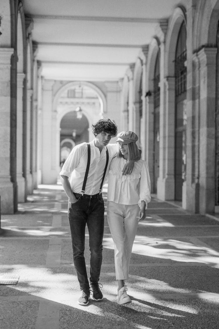 Grayscale Photo Of Lovers Walking Together 