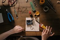 Person Holding Yellow and Black Pen