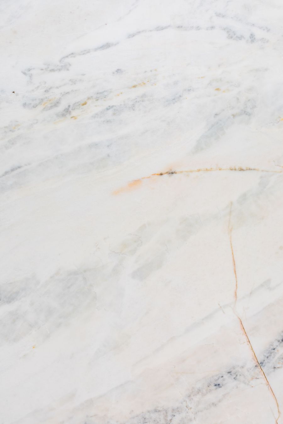 Close-up of a sealed natural stone surface resisting water droplets