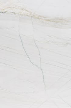 High-quality close-up of white marble texture, perfect for backgrounds and designs.