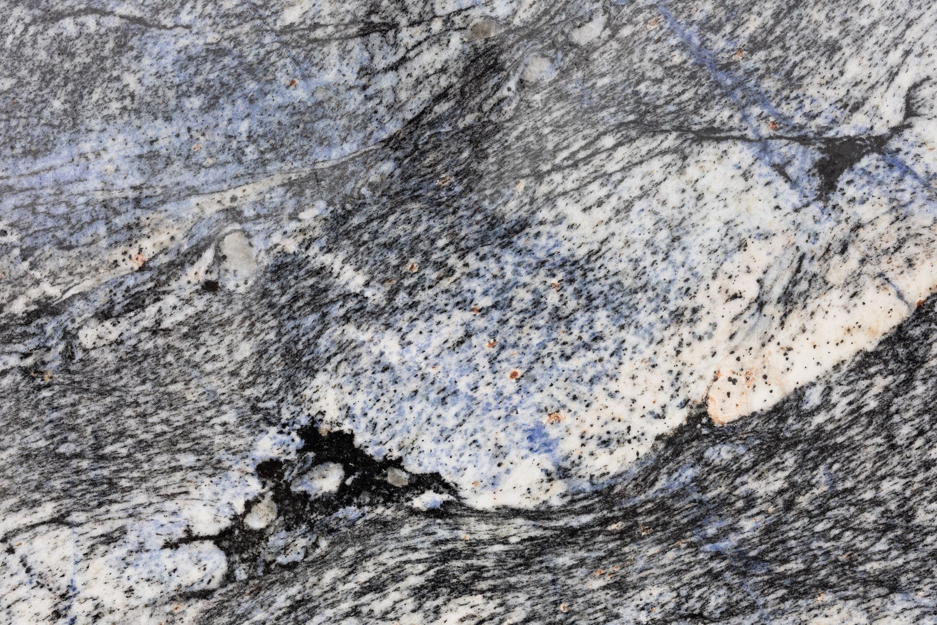 Detailed close-up of a textured granite surface showcasing natural patterns.