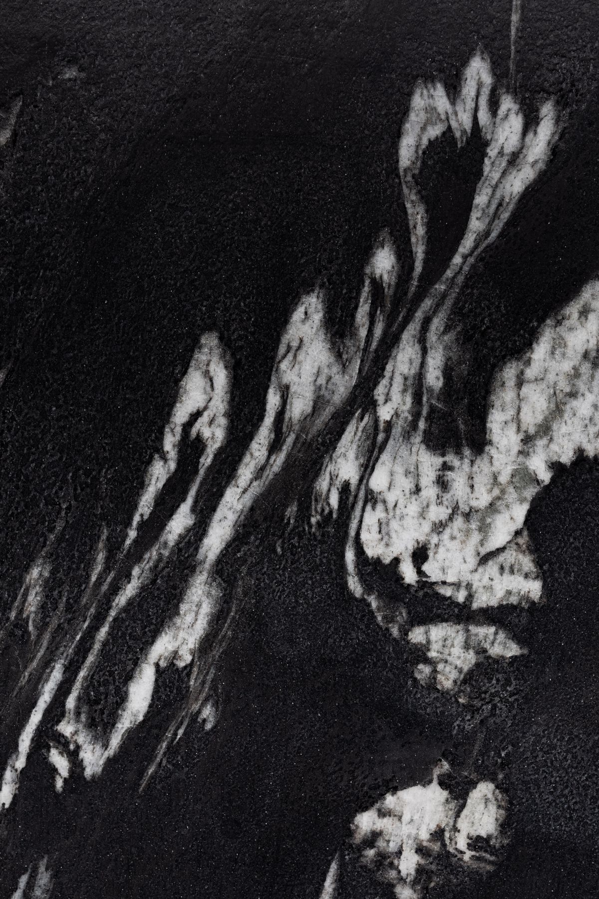 Dark black and white marble pattern with intricate texture