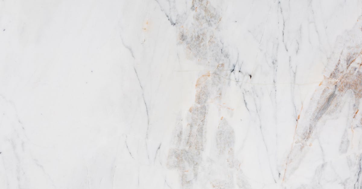 A construction worker wearing safety gear and a reflective vest, inspecting solar panels on a rooftop of a building under construction.