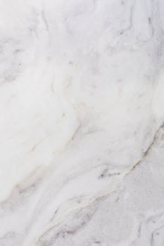 High-resolution white marble texture with natural patterns, ideal for design and architecture projects.