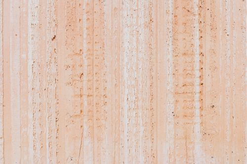 Free Detailed close-up of a textured beige wall surface, perfect for backgrounds and design elements. Stock Photo