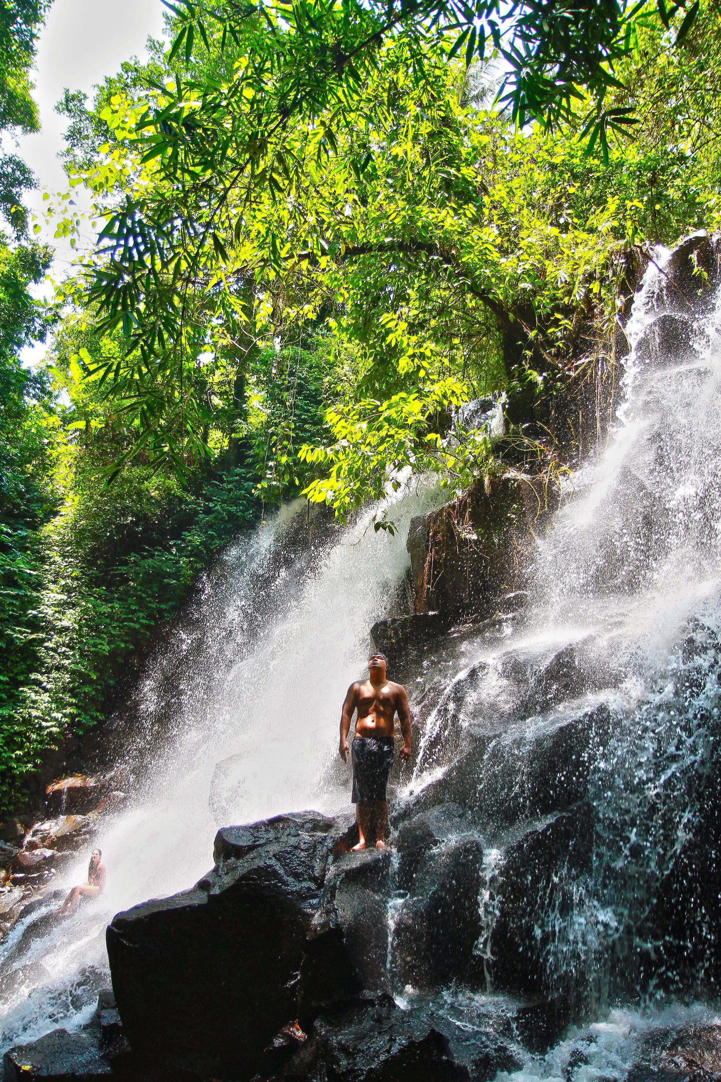 Woman Standing in Front of Flowing Water · Free Stock Photo