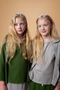 2 Woman in Gray and Green Shirts