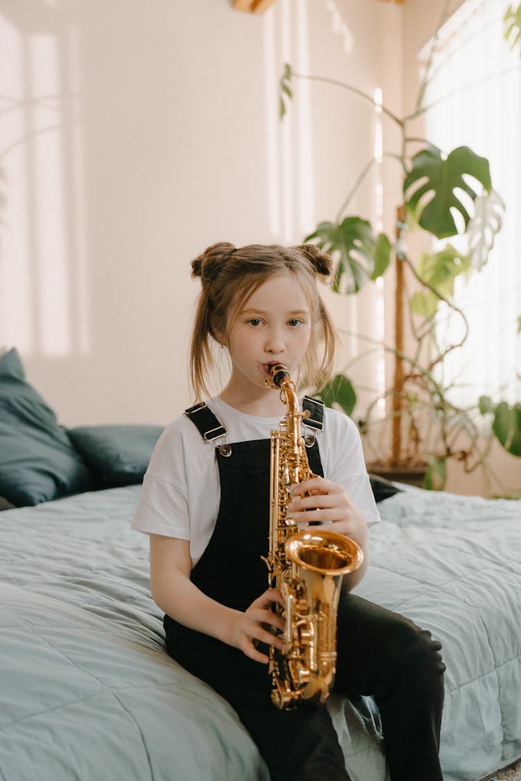 Girl In Black T-shirt Playing Saxophone