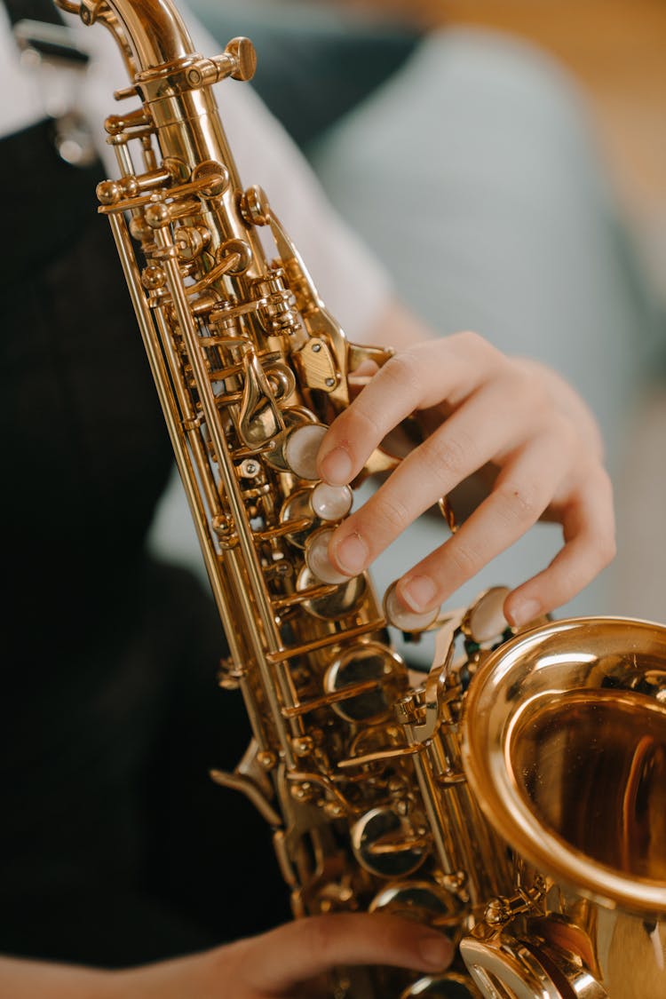 Gold Saxophone In Black Background