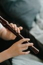 Person Holding Brown Glass Bottle