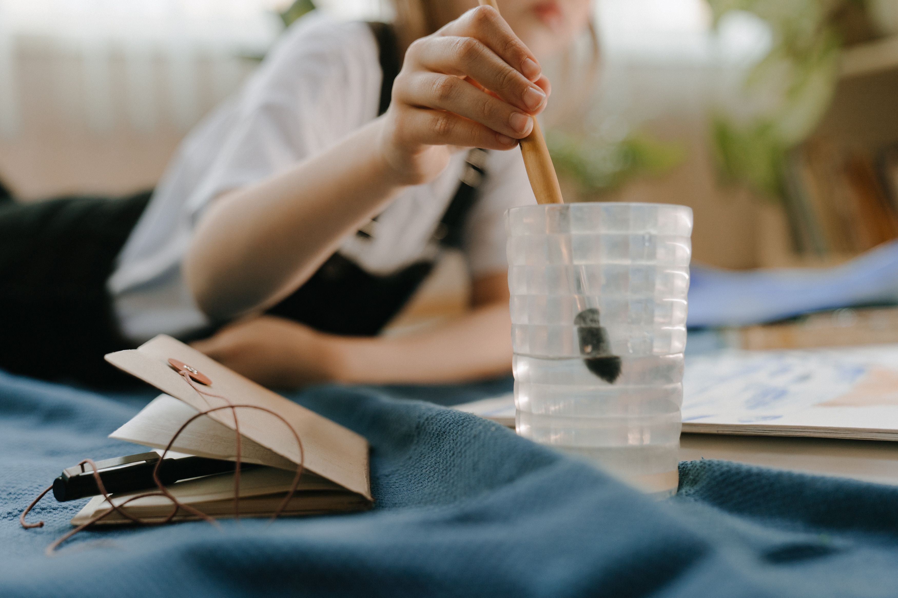 Person Holding Black Pen on White Paper · Free Stock Photo
