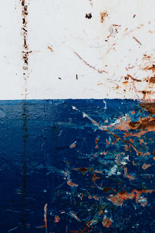 Rust and Dirt on White and Blue Wall