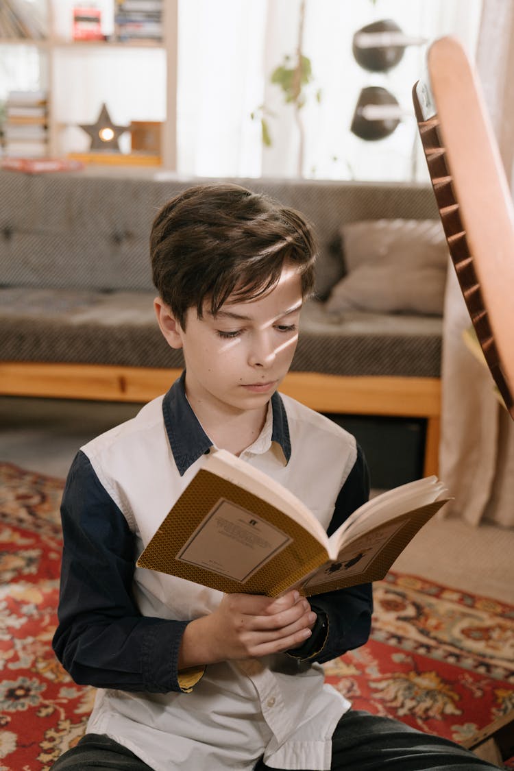 Boy In White And Black School Uniform Reading Book