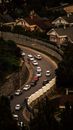 Cars on  Curved Road Near Houses