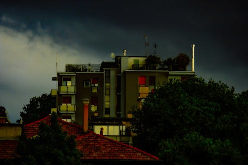 Modern green residential building at dusk