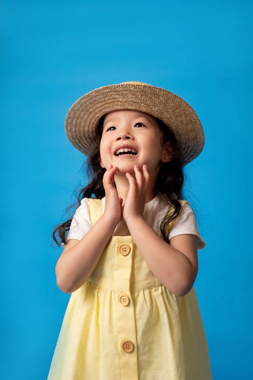 Free Girl in White Button Up Shirt Wearing Brown Hat Stock Photo