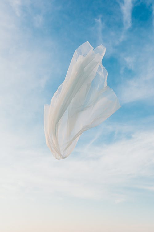 White Textile Under Blue Sky