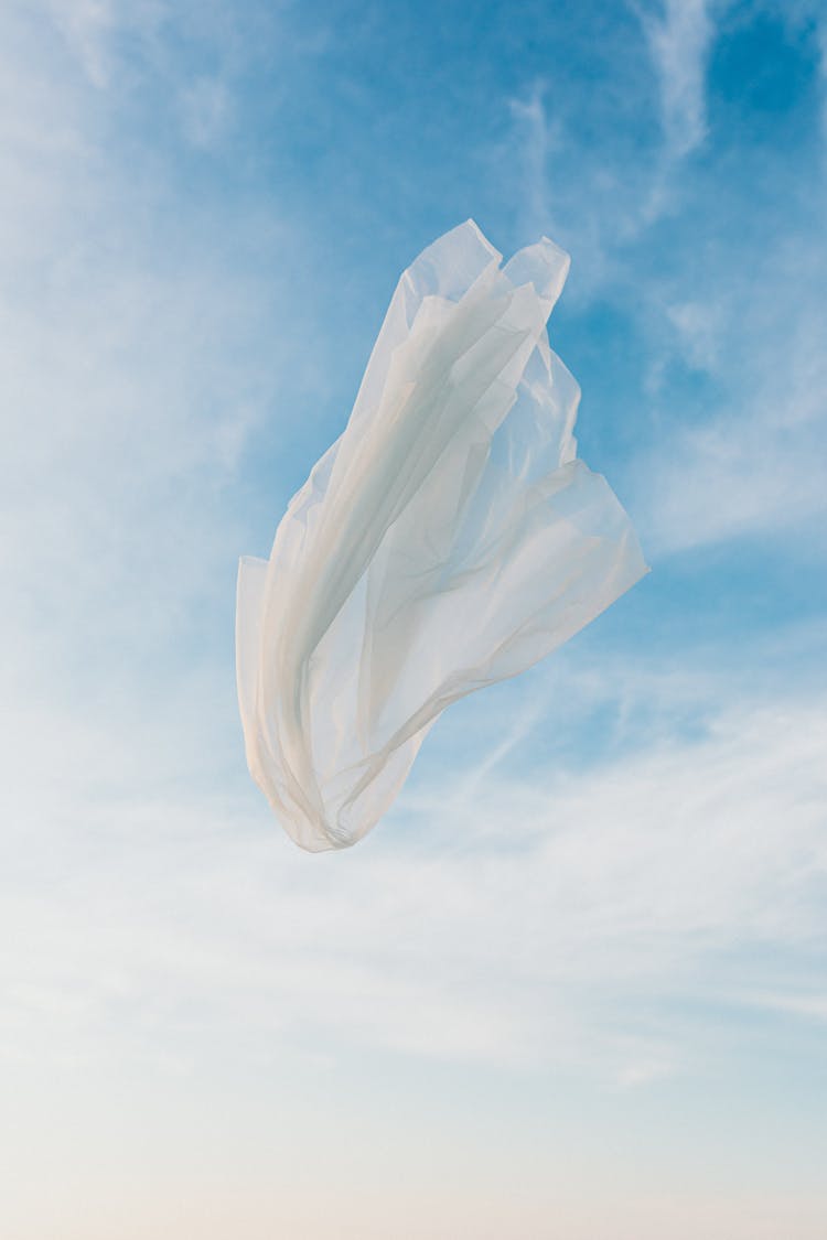 White Textile Under Blue Sky