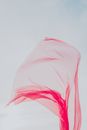 Flowing Red Textile in Blue Background