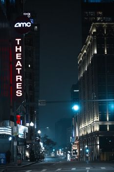 Capture of an illuminated street at night with AMC Theatre sign in Boston, MA.