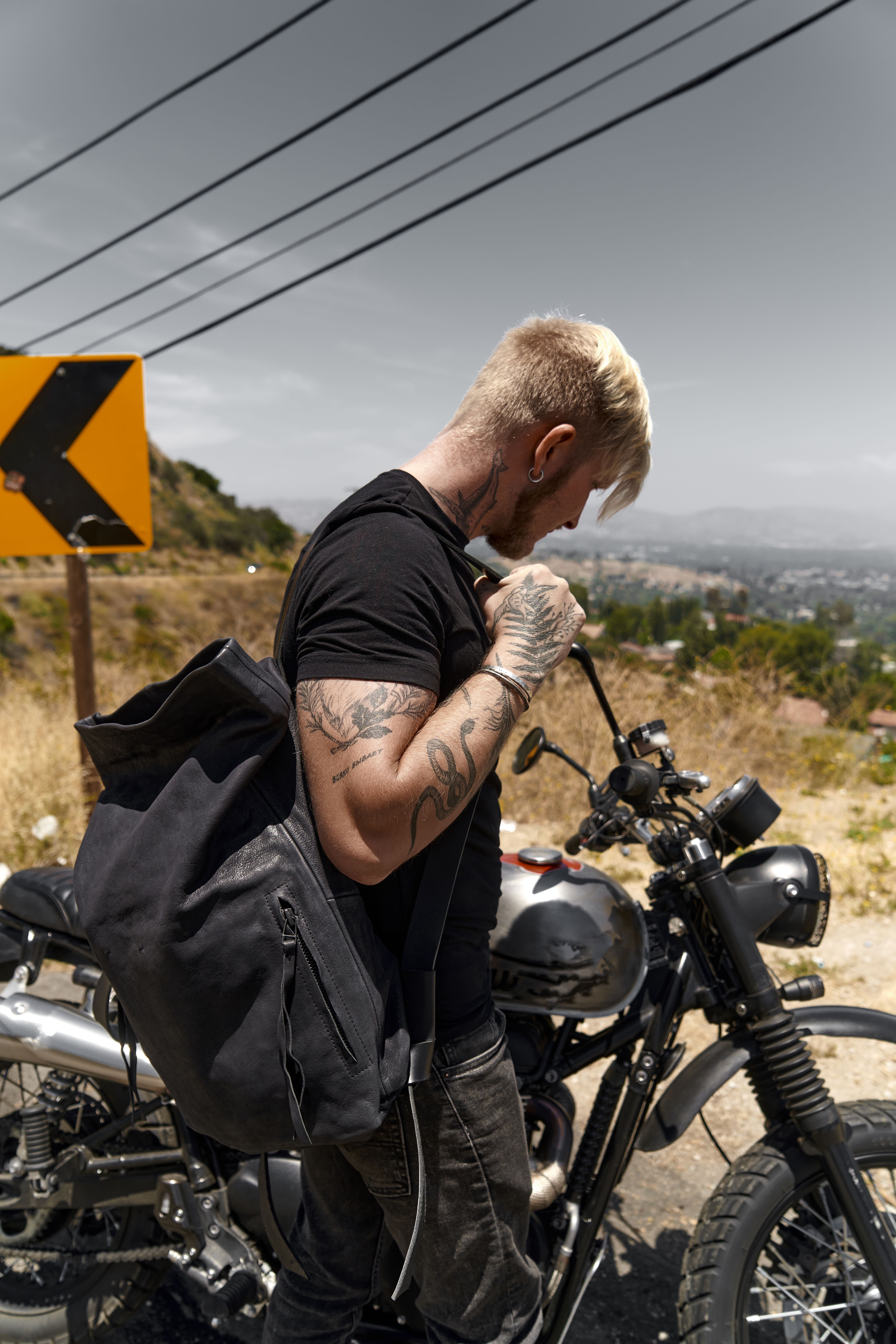 Man in Black Shirt and Black Backpack Standing Near Motorcycle · Free ...