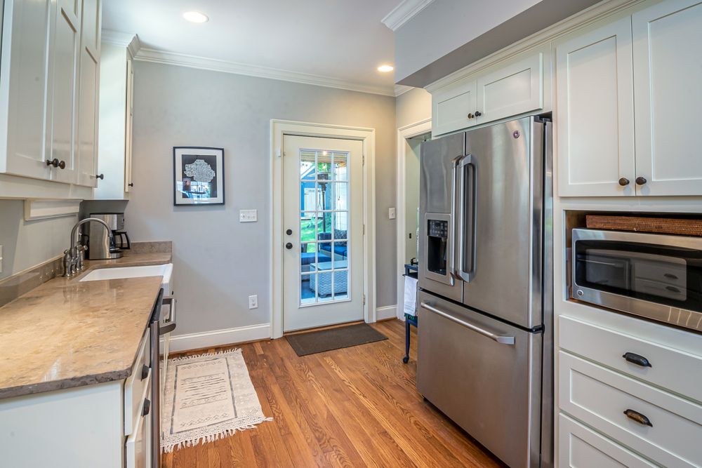 Bright kitchen with stainless steel appliances typical of homes served by Appliance Repair Arlington TX