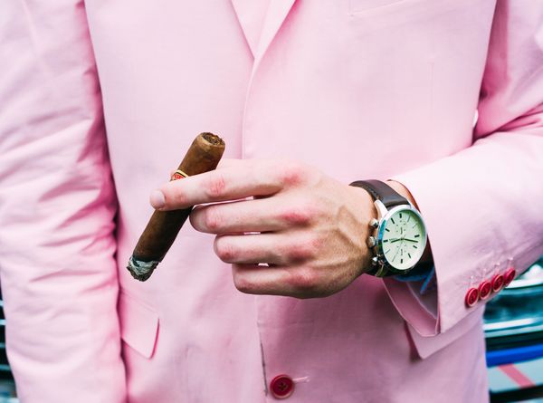 Gentleman holding a premium cigar